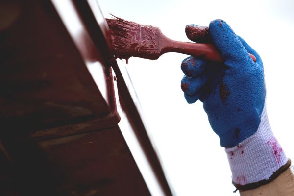 Gutters Getting Painted In Red Colour